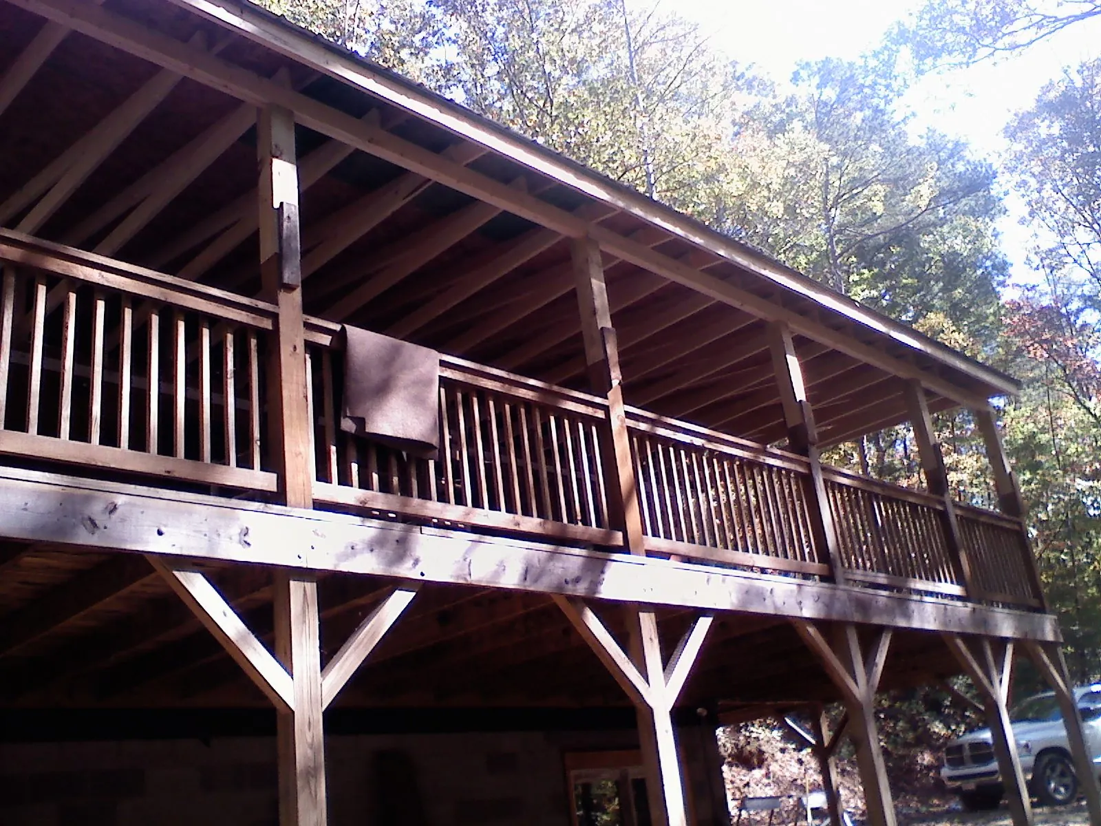 Timber framing under a new elevated porch and deck — Roof Leak Repair in Pine by Roofing Brothers